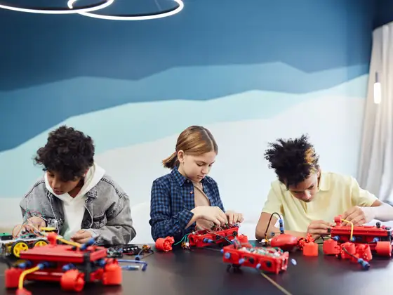 A group of students collaborating on a science and technology project